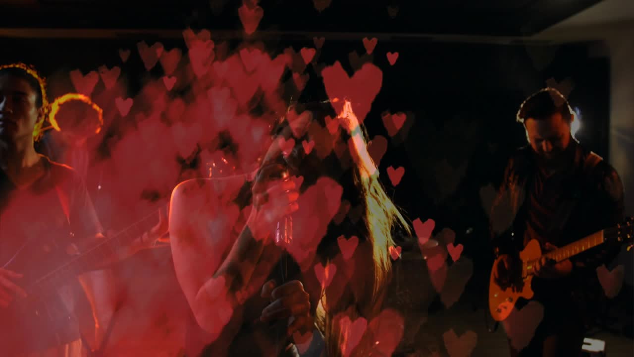 Fog rolling sparking heart overlays singer whipping hair gripping mic expressing music passion