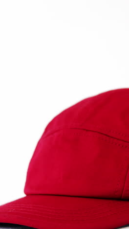 red cap against white background