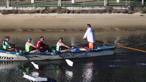 crew team in synchronized rowing training