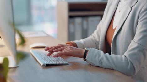 hands of woman at desk with computer