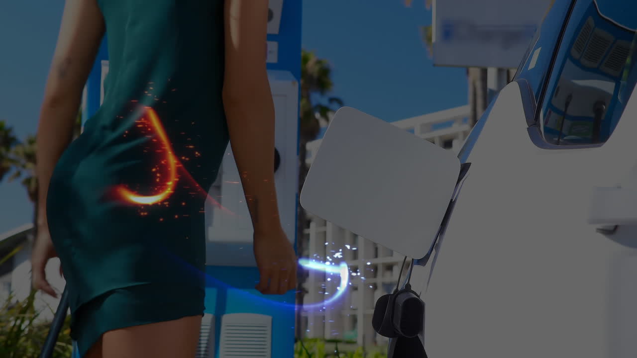 전기 자동차를 충전하는 사람이 연결망의 선을 움직이고 있습니다.