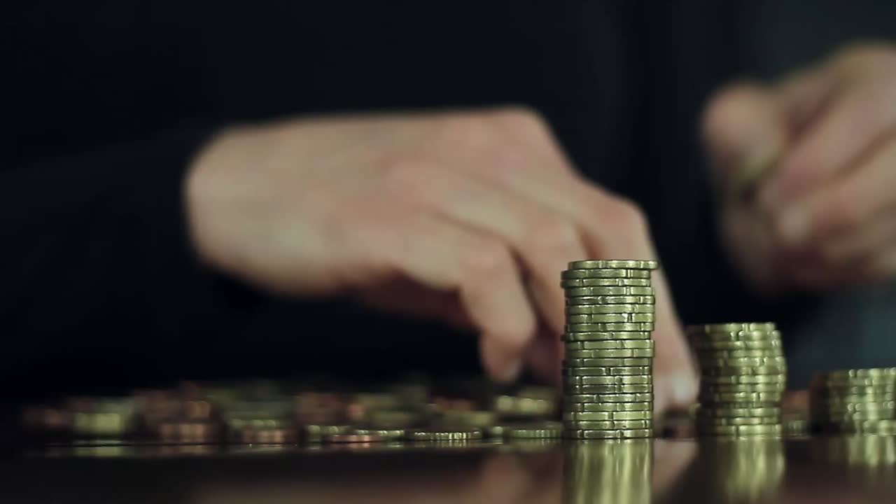 money coins stacked high saving money for the future investment of money with stock video stock footage