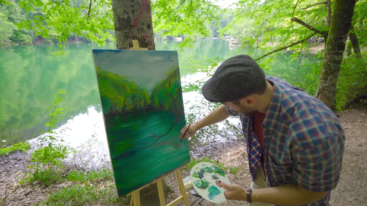 Talented and modern painter draws pictures.