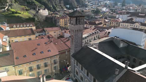 bellinzona switzerland rising view of church tower with busy city square below