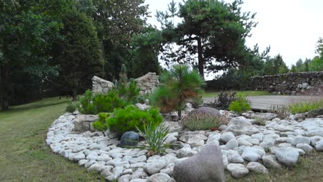 gorgeous flower bed and stone garden composed of white rocks and stones