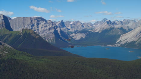 A-thrilling-helicopter-tour-of-the-Canadian-Rocky-Mountains,-breathtaking-aerial-views-of-snow-capped-peaks,-glaciers,-rivers,-and-forests