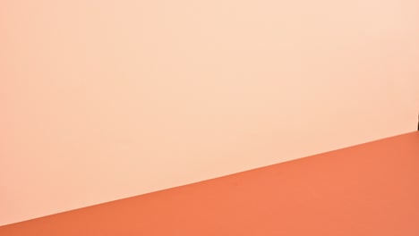 bright hardcover books ordering one on other on deep an bright orange theme. stop motion