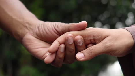 couple holding hands: a symbol of love and togetherness