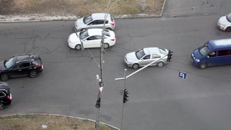 vehicles driving in the asphalt road with traffic lights