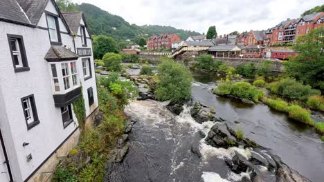 river flowing through picturesque town in wales