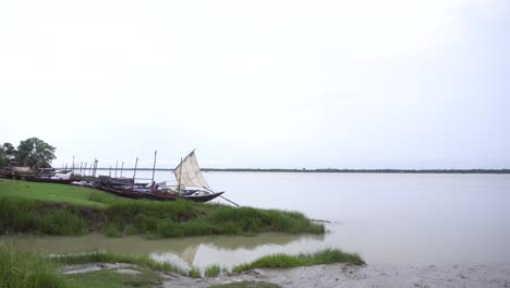 sailing boat stood on the river banks