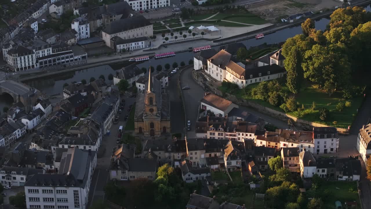 Aerial view of a European town with a river and church