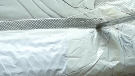 close-up of white plastic packaging being opened