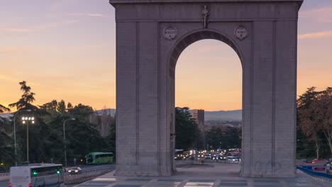 sunset in front of moncloa arch and faro de moncloa