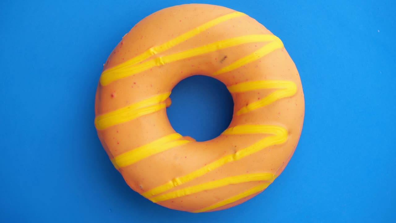 el donut está vidriado de cerca, con un bucle sin costuras.