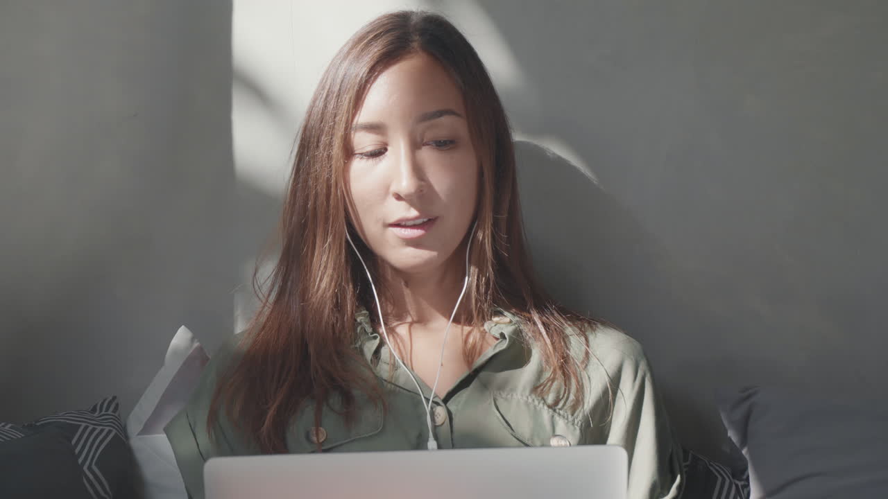 Caucasian Woman Video Calling via Laptop