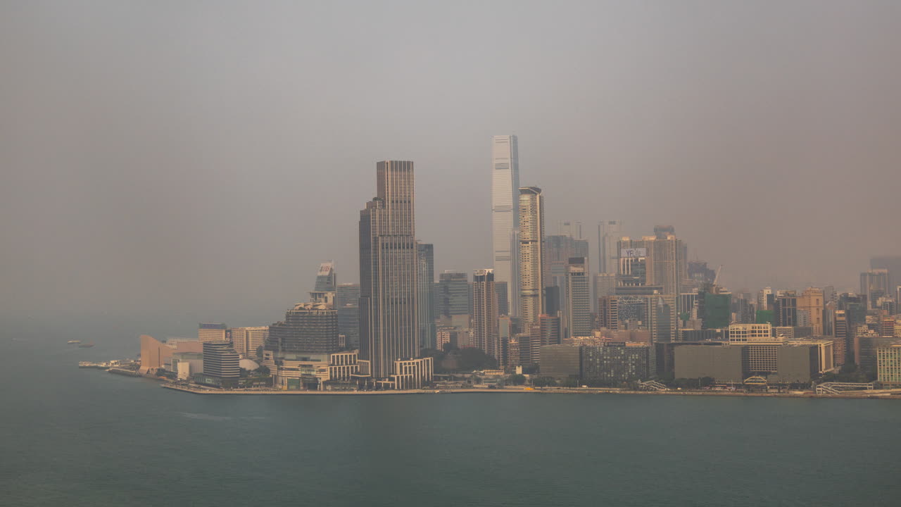 HONG KONG - 19 MARCH 2025 : Timelapse of the Hong Kong skyline and victoria harbour from a high vantage point