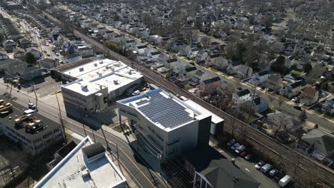 an aerial view of an office building with solar panels on the roof on a sunny day