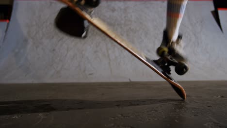 man practicing skateboarding in skateboard arena 4k