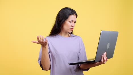 confused young woman using laptop