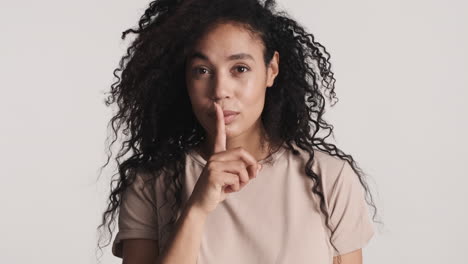 african american confident woman over white background.