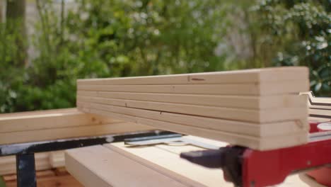 Close-up-of-stacked-wood-planks