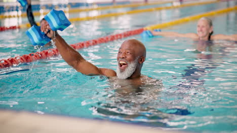 seniors doing water aerobics in a swimming pool
