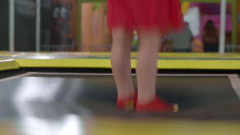 girl jumps on a trampoline