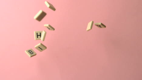 letter pieces spelling happy birthday coming together