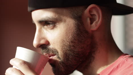 Closeup-of-man-drinking-a-hot-cup-of-tea-or-coffee