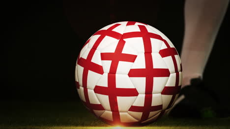 Football-player-kicking-england-flag-ball