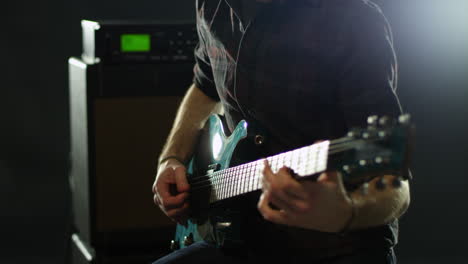 close up of man playing electric guitar shot on r3d