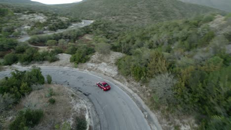 aerial - car driving down the many curves in a road, tamaulipas, mexico, tracking