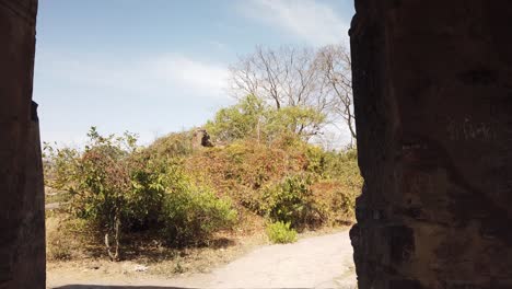 tracking shot through archway of ancient ranthambore fort, rajasthan, india