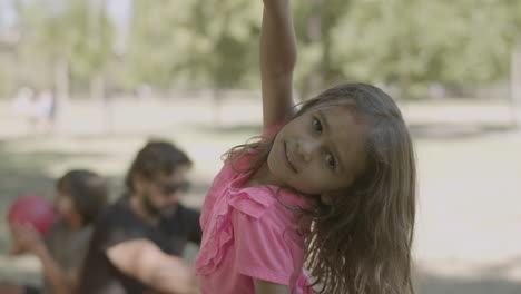 Front-view-of-little-girl-mugging-and-posing-for-camera