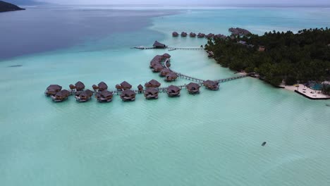 aerial view of shallow lagoon villa suites in south seas polynesia