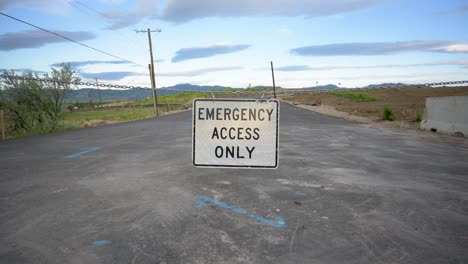 Road-closed-leading-to-a-new-housing-subdivision-in-the-mountains,-close-up-static