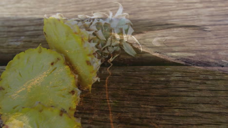 pineapple slices on wooden surface with tropical leaves creating animation effect