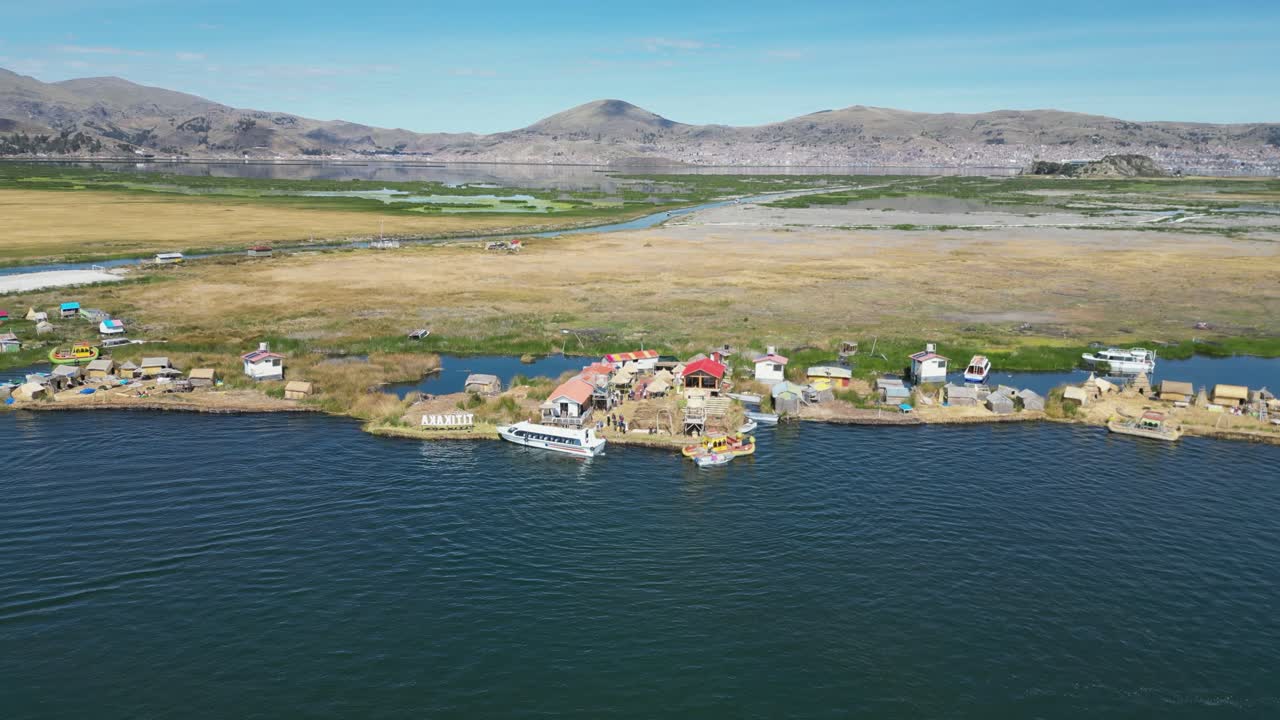 Aerial rises from unique floating Uros Islands on Lake Titicaca, Peru