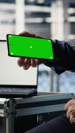 vertical video data center worker uses isolated screen smartphone while deploying deep learning