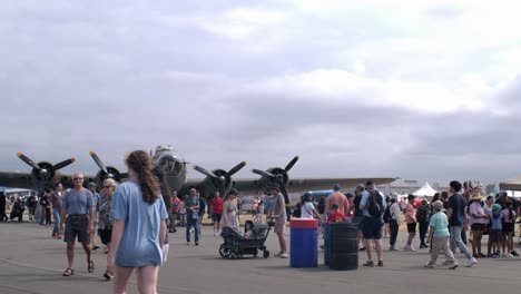 visitors at abbotsford airshow 2024 - b-17 bomber on display slomo