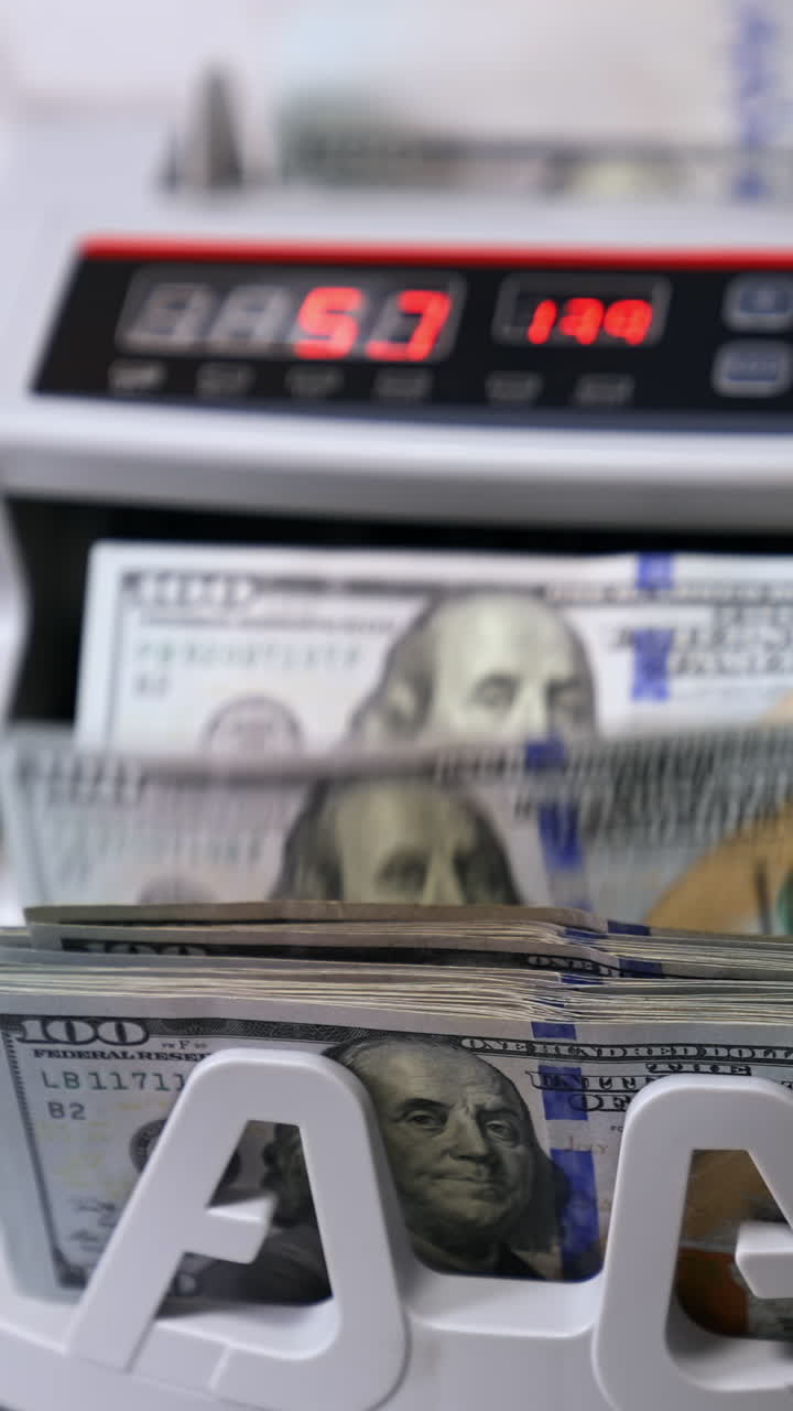 Counting machine for USD dollar paper banknote. Banknote counter. Vertical video