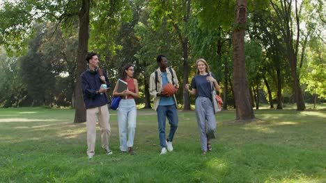 group of students walking in a park
