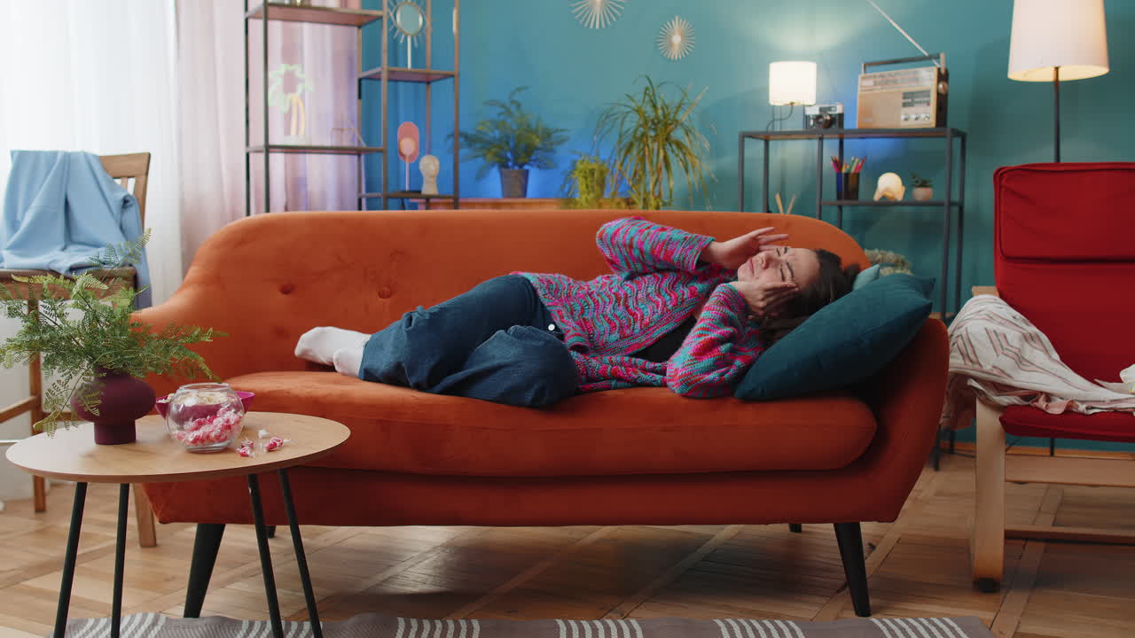 Displeased caucasian woman rubbing temples to cure headache problem suffering from migraine stress