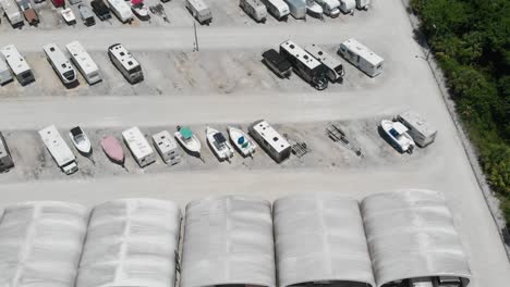 forward drone aerial over boat and camper storage lot in south florida