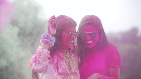 girls playing indian festival holi celebration slowmotion