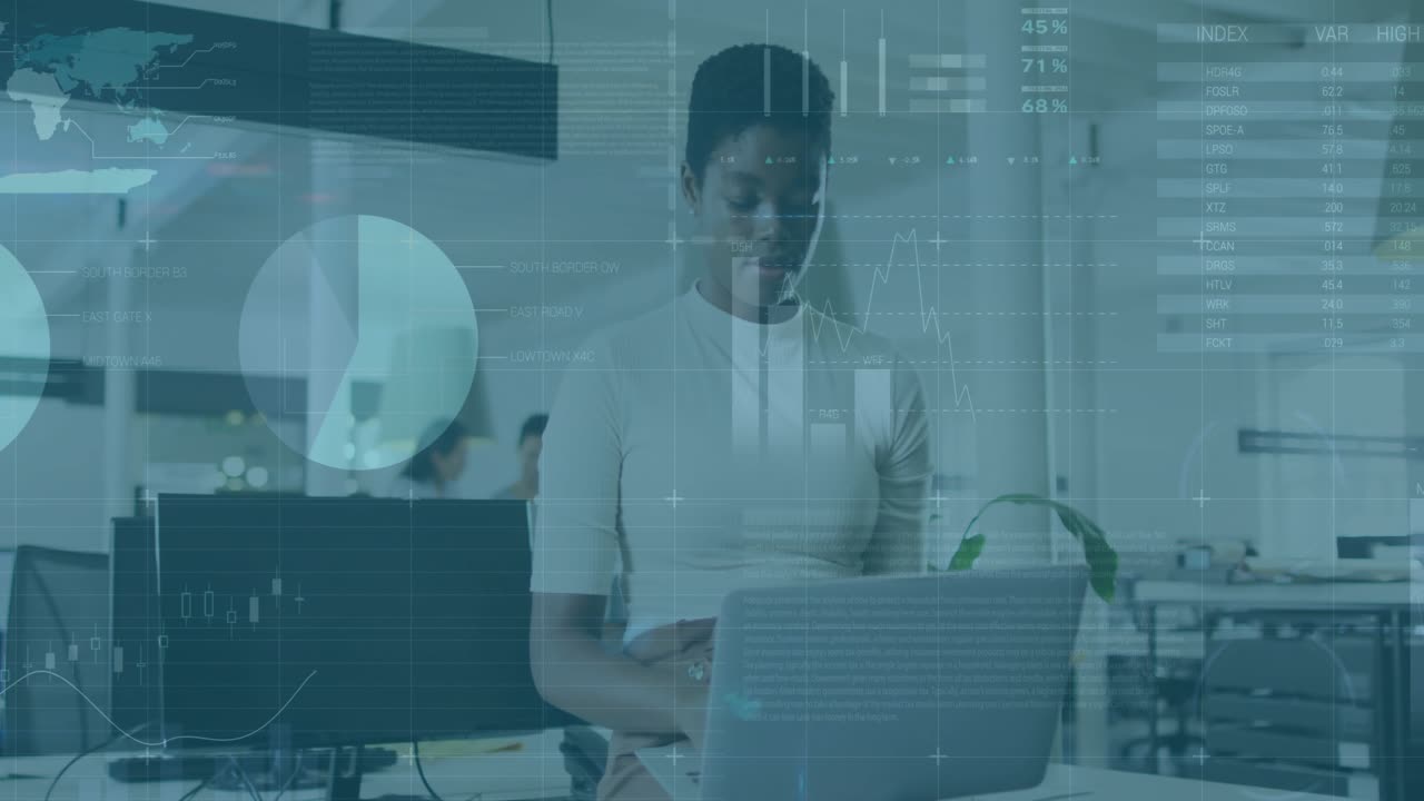 Woman scanning tablet for analytics and overlaying charts graphs and tables over laptop