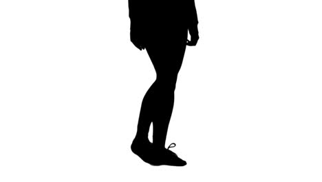 silhouette of woman stretching her legs