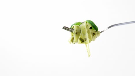 Close-up-of-cooked-pasta-with-capsicum-on-fork