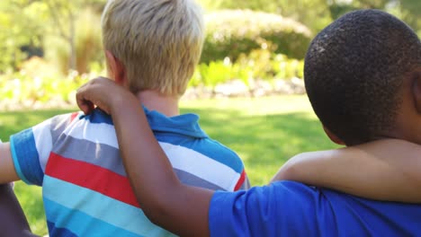 group of kids standing together with arms around